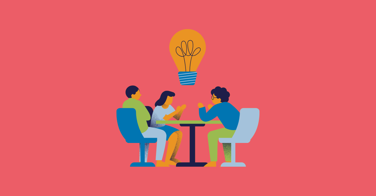 A team of illustrated figures sit around a small round table on a red background with a large stylized lightbulb hovering above them.